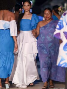 Women dressed in blue and white on catwalk